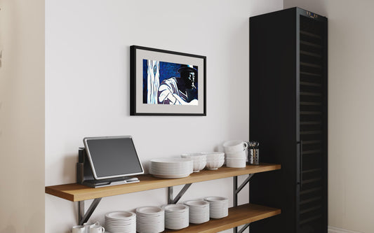 Kitchen setup with a black refrigerator, wooden shelf with kitchenware, and framed picture on the wall.