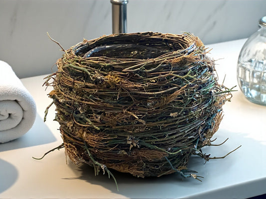 Artificial bird's nest on a surface with a neutral background