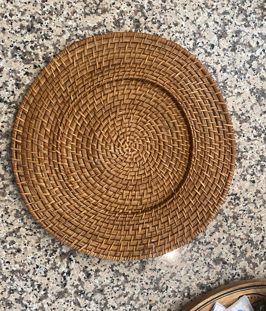 Woven placemat on a speckled countertop