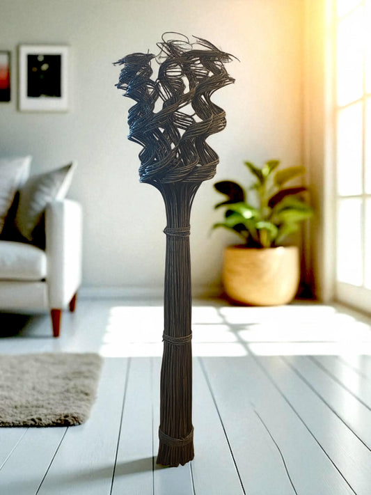 Wicker sculpture on a white floor with a blurred indoor background
